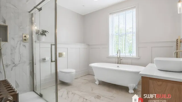 Refurbished bathroom with freestanding bath and walk-in shower