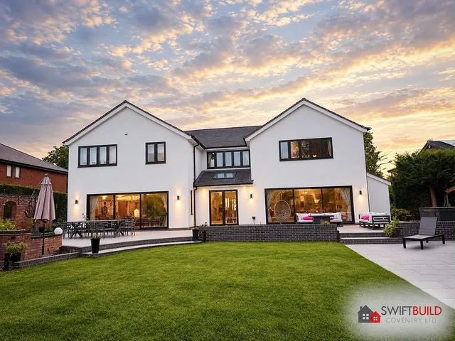 Two-storey rear extension with landscaped lawn at dusk